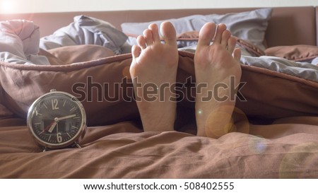 Time to say Good morning on the bed, The alarm clock, wake up Royalty-Free Stock Photo #508402555