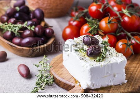 Greek cheese feta with thyme and olives, selective focus Royalty-Free Stock Photo #508432420