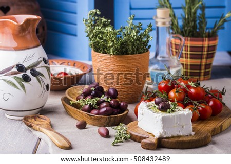 Greek cheese feta with thyme and olives, selective focus Royalty-Free Stock Photo #508432489
