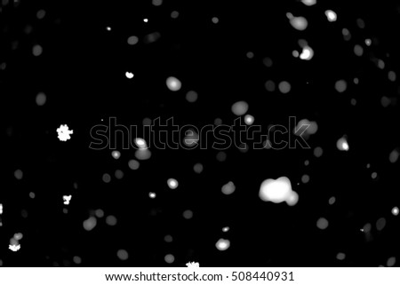 White blurred points bokeh on a black background