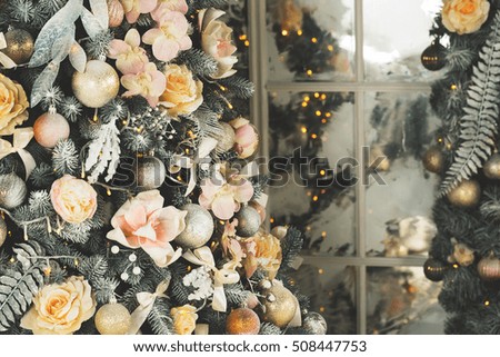 Beautiful background decorated Christmas tree with toy balls and garlands.The idea for postcards. Soft focus. Shallow DOF