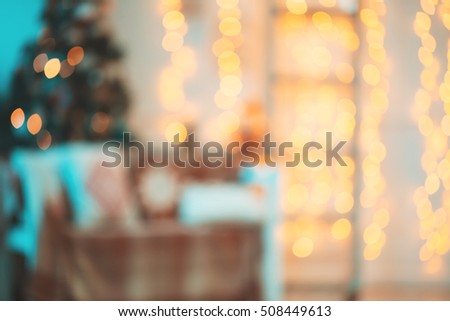 Beautiful Defocused background Living new year room with decorated Christmas tree, gifts and fireplace. The idea for postcards. Soft focus. Shallow DOF