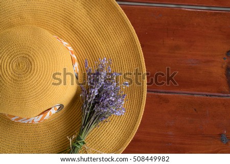 
Still on the table with a yellow hat and purple flowers. sage, spice on the table