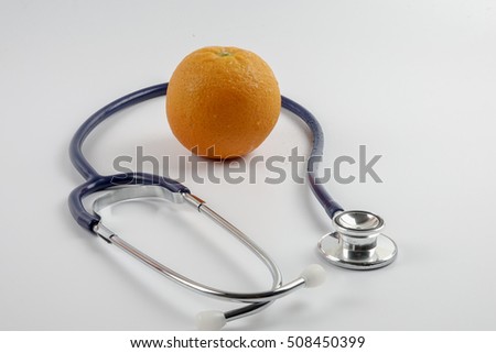 Stethoscope with orange  concept for diet, healthcare, nutrition or medical insurance