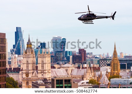 Helicopter over London skyline, old and new.
