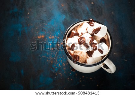Chocolate with marshmallow. Hot winter drink in the mug. Top view with copy space.