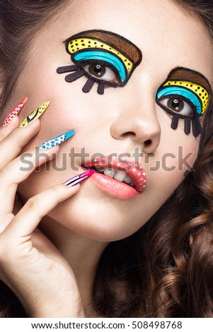 Photo of surprised young woman with professional comic pop art make-up and design manicure. Creative beauty style and nails. Photos shot in studio