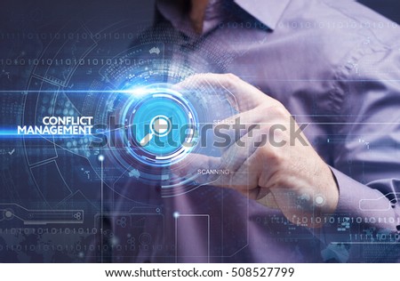 Business, Technology, Internet and network concept. Young businessman working on a virtual screen of the future and sees the inscription: conflict management