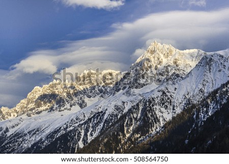 Winter mountain landscape at sunset in Alps.