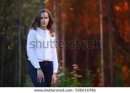 Photo before and after the image editing process. Young beautiful woman in the autumn forest