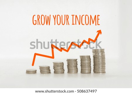 Conceptual image. Stacks of coins against white background with red arrow and words.
