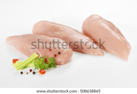 Raw chicken fillets, isolated on white background
