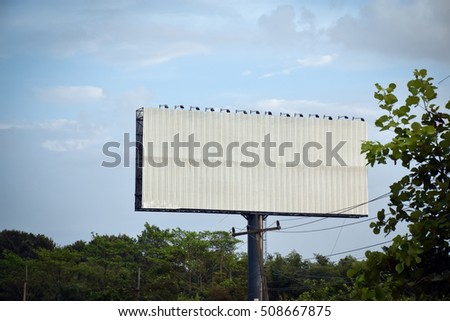 Metal Big Blank billboard ready for new advertisement Beside Road,with clouds blue sky in background,Billboard with empty and blue sky.