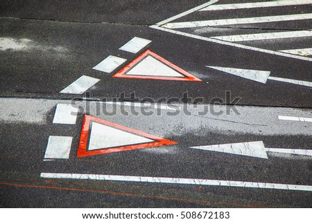 yield sign marked at the street in vienna, Austria