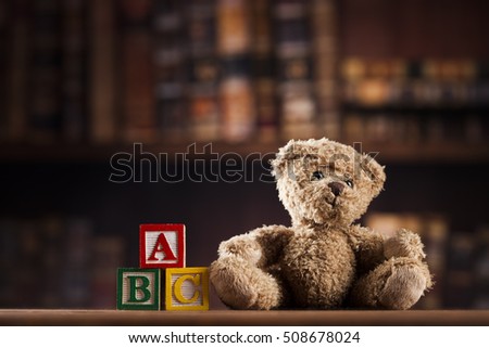 Teddy bears on on vintage wooden background
