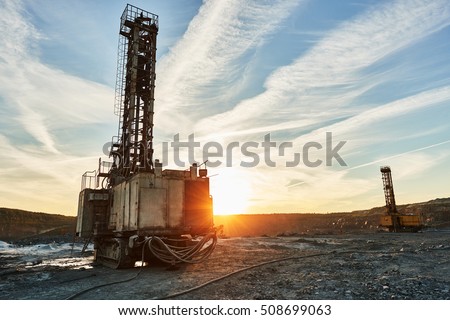 Rotary drill machines for surface blasthole mining industry in quarry Royalty-Free Stock Photo #508699063