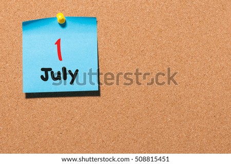 July 1st. Day 1 of month, color sticker calendar on notice board. Summer time. Empty space for text