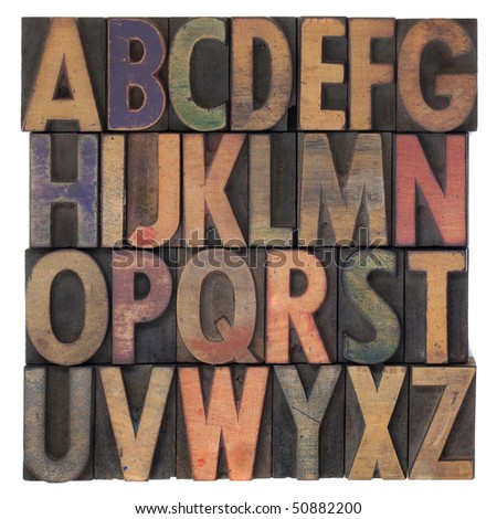 English alphabet (upper case) in vintage wooden letterpress type, stained by different color ink, flipped horizontally, isolated on white Royalty-Free Stock Photo #50882200