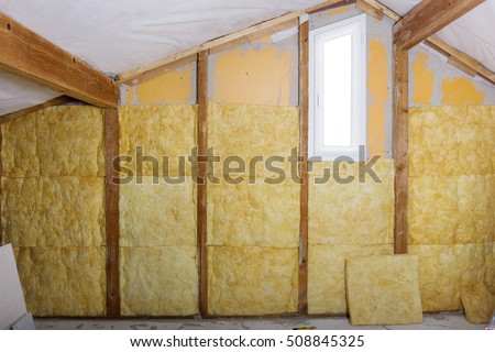 termal insulation installing at the attic Royalty-Free Stock Photo #508845325