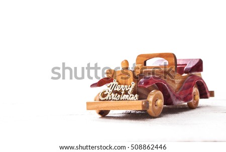 Retro wooden car with merry christmas sign,Christmas  card. Merry Christmas custom lettering.