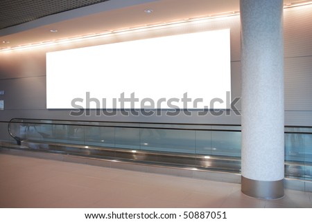 empty billboard and modern escalator at a international airport