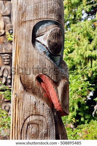 Close up photograph from a totem pole standing in Victoria , Vancouver island, Canada