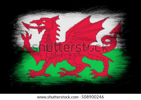 Flag of Wales - Painted grunge flag, brush strokes. Isolated on black background.
