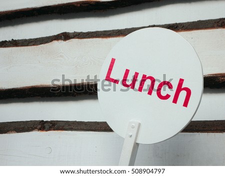 lunch sign on wooden background
