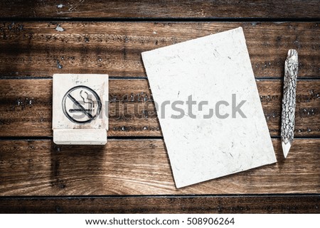 No Smoking sign with blank mulberry paper and wooden pencils with copy space