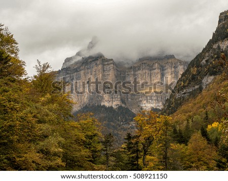 Beautiful and foggy valley in autumn in Ordesa National Park (Pyrenees, Spain)