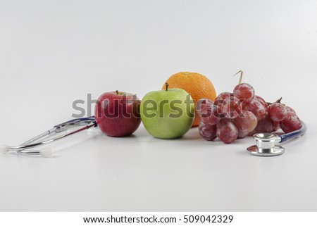 Stethoscope with fruits  concept for diet, healthcare, nutrition or medical insurance