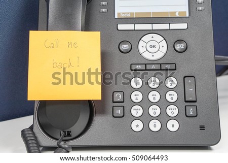 close up message on sticky note of calling back attach on IP phone