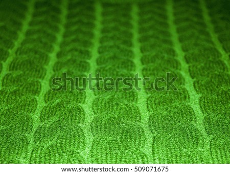 Green woolen knitted cloth, background