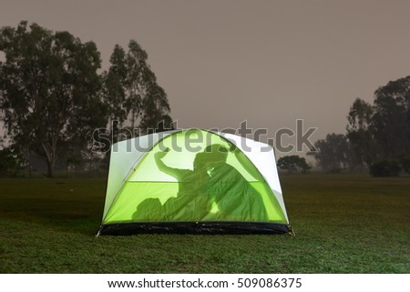 silhouette of people are camping outdoor and selfie with tent , great for your design