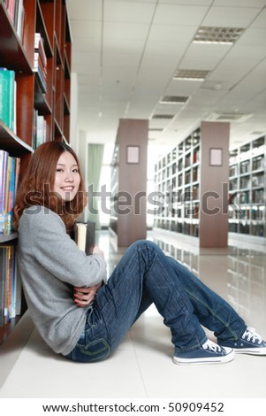 young asian girl in library