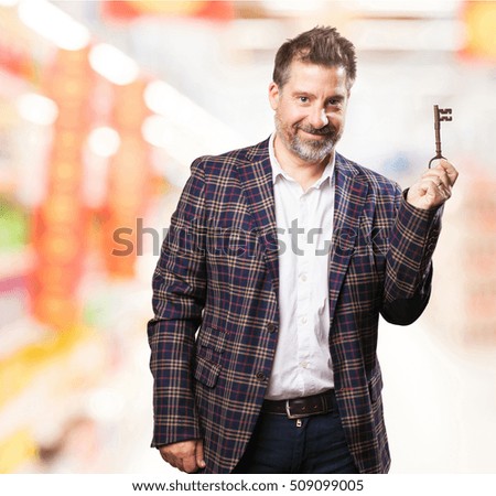 architect man holding an old key