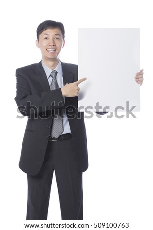 Businessman holding empty board, blank board for edited.Tall Man pointing at paper sheet with smile on his face.