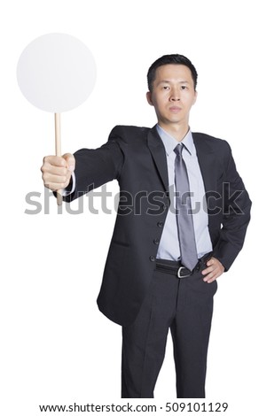 Handsome businessman holding placard, blank round placard for edited. Man with serious face.