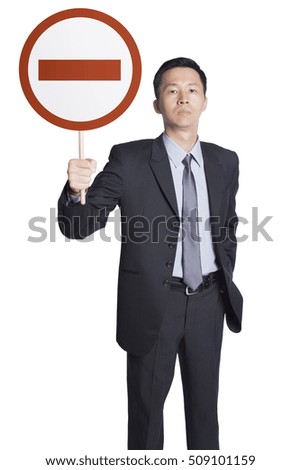 Businessman holding no entry sign, Man with serious face.