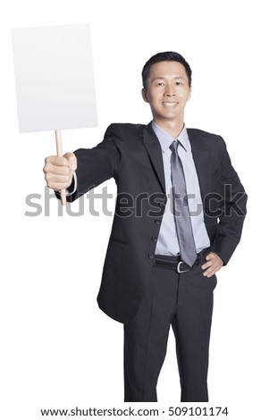 Handsome businessman holding placard, blank placard for edited. Man with smile on his face.