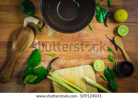 Top view ingredients TomYam on a wooden table. TomYam is Thaifood. A popular and famous throughout the world.