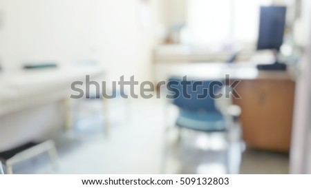 Blur abstract background inside empty patient examination room with bed in OPD ward. Blurry doctor desk for diagnosis sick people working space in hospital. Defocused interiors healthcare work place. Royalty-Free Stock Photo #509132803