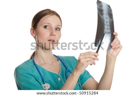 Young female doctor looking at the xray picture