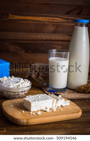Dairy products. On wooden background.