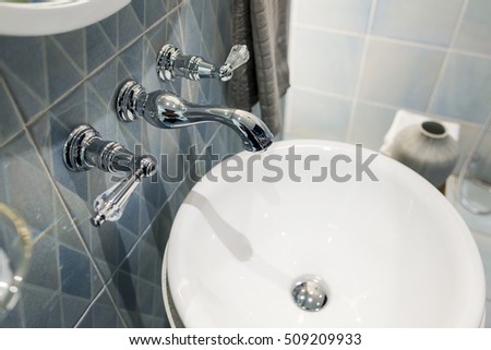 Modern Faucet in bathroom interior with sink, 
