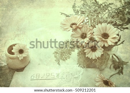 Background in style grunge, nostalgic, green. An ancient shabby card, composition with a marigold and letters. Basis for design.