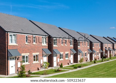 Row of new houses, England Royalty-Free Stock Photo #509223637