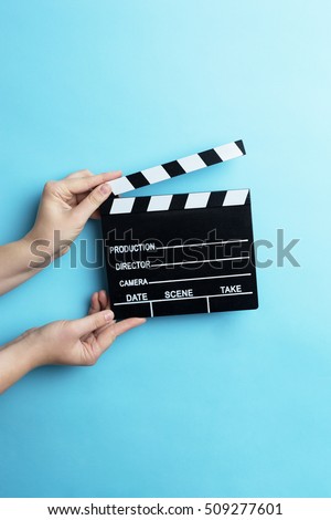 movie clapper on blue background, cinema concept