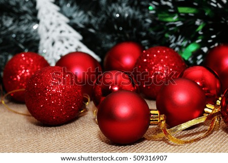 Beautiful multi-colored Christmas ornaments. Red balloons. tinsel, ribbons, decorative tree ...
