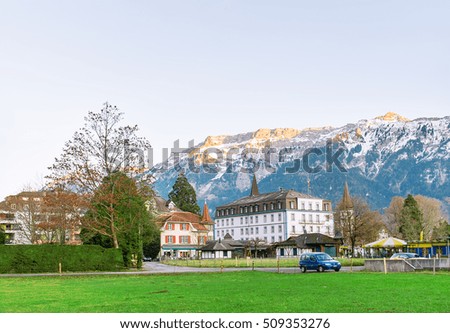 INTERLAKEN, SWITZERLAND - DECEMBER 25, 2015: The ancient castle against the background of mountains